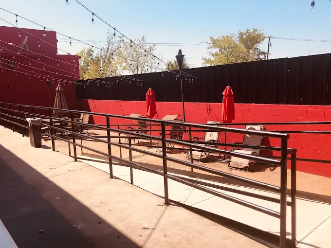 An empty area with railing outside the bar
